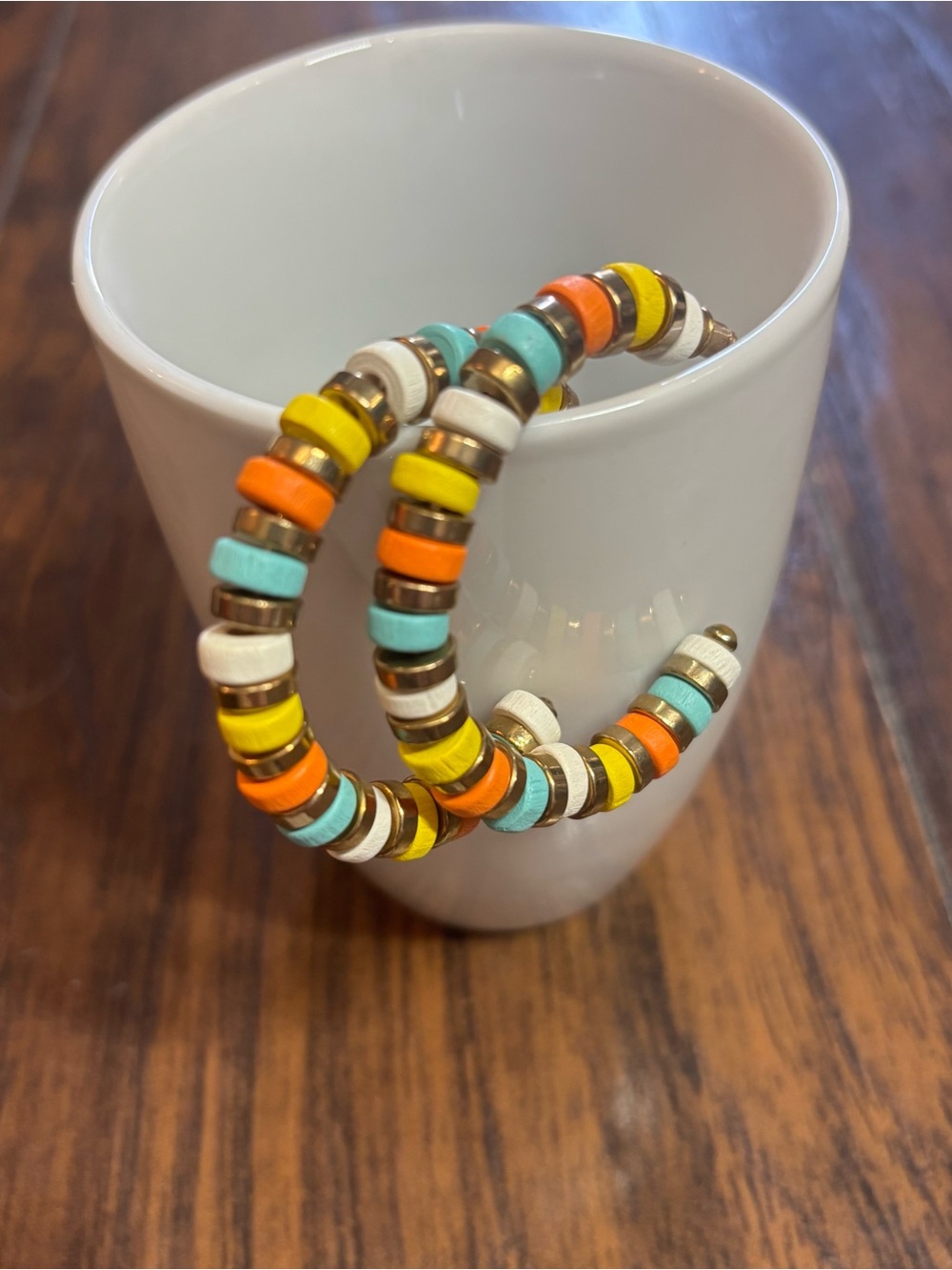 Orange yellow and blue beaded hoop earrings